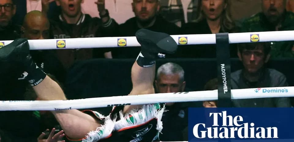 Boxer falling through the ropes during match