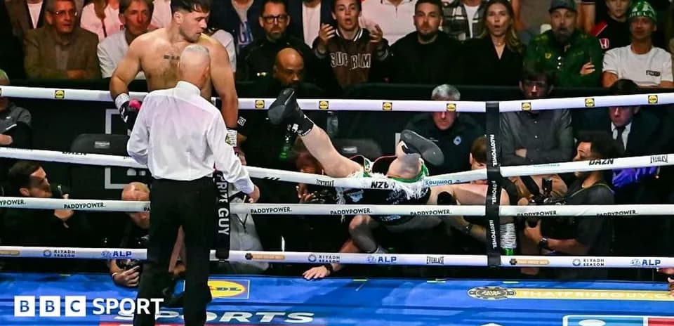 Boxer falling out of the ring after a punch
