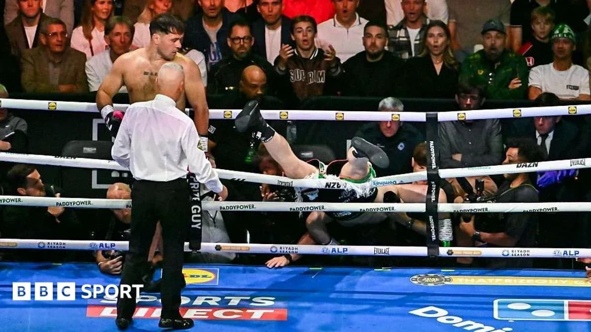 Boxer falling out of the ring after a punch