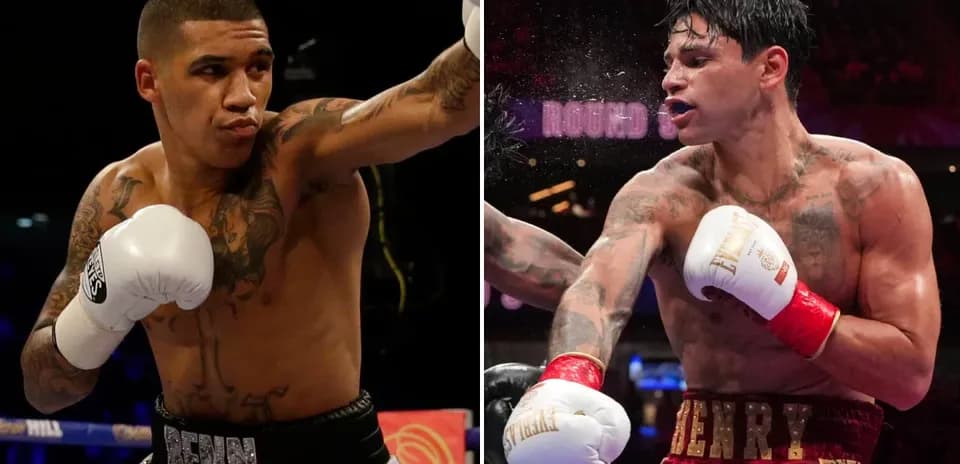 Boxeadores Benn y Henry en acción durante combate