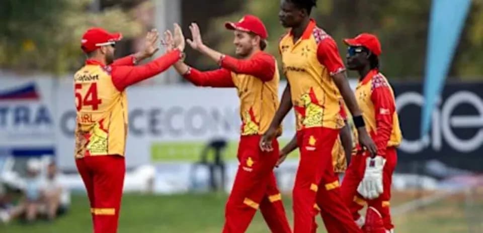 Jugadores de cricket celebrando una captura exitosa