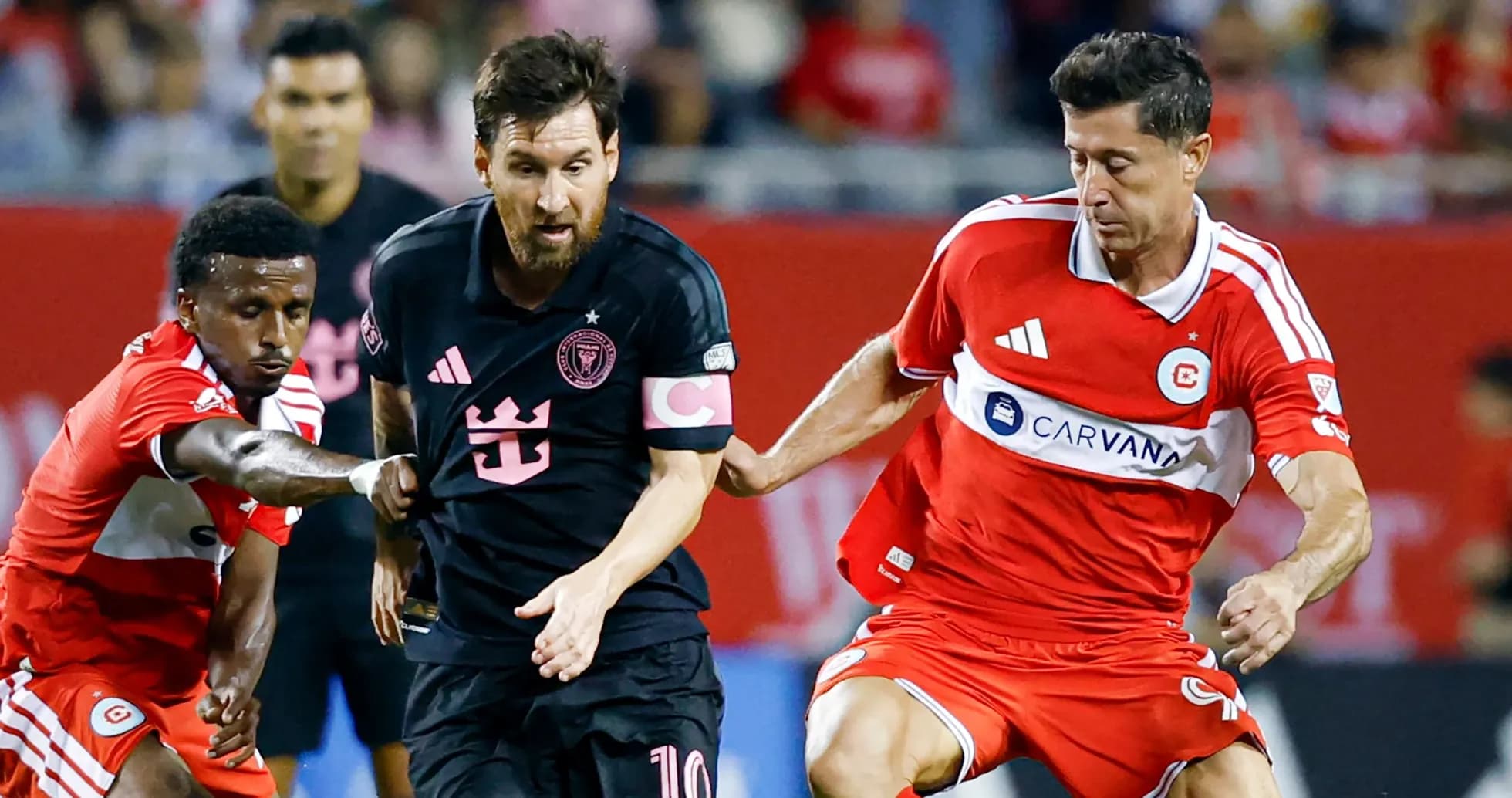 Lionel Messi dribbling past two defenders during match Lionel Messi dribbling past two defenders during match