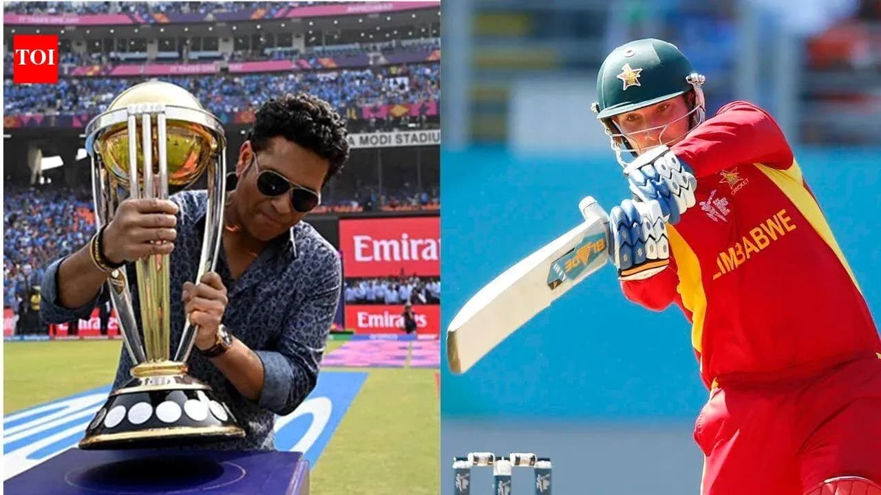 Sachin Tendulkar holding trophy; batsman from Zimbabwe Sachin Tendulkar holding trophy; batsman from Zimbabwe