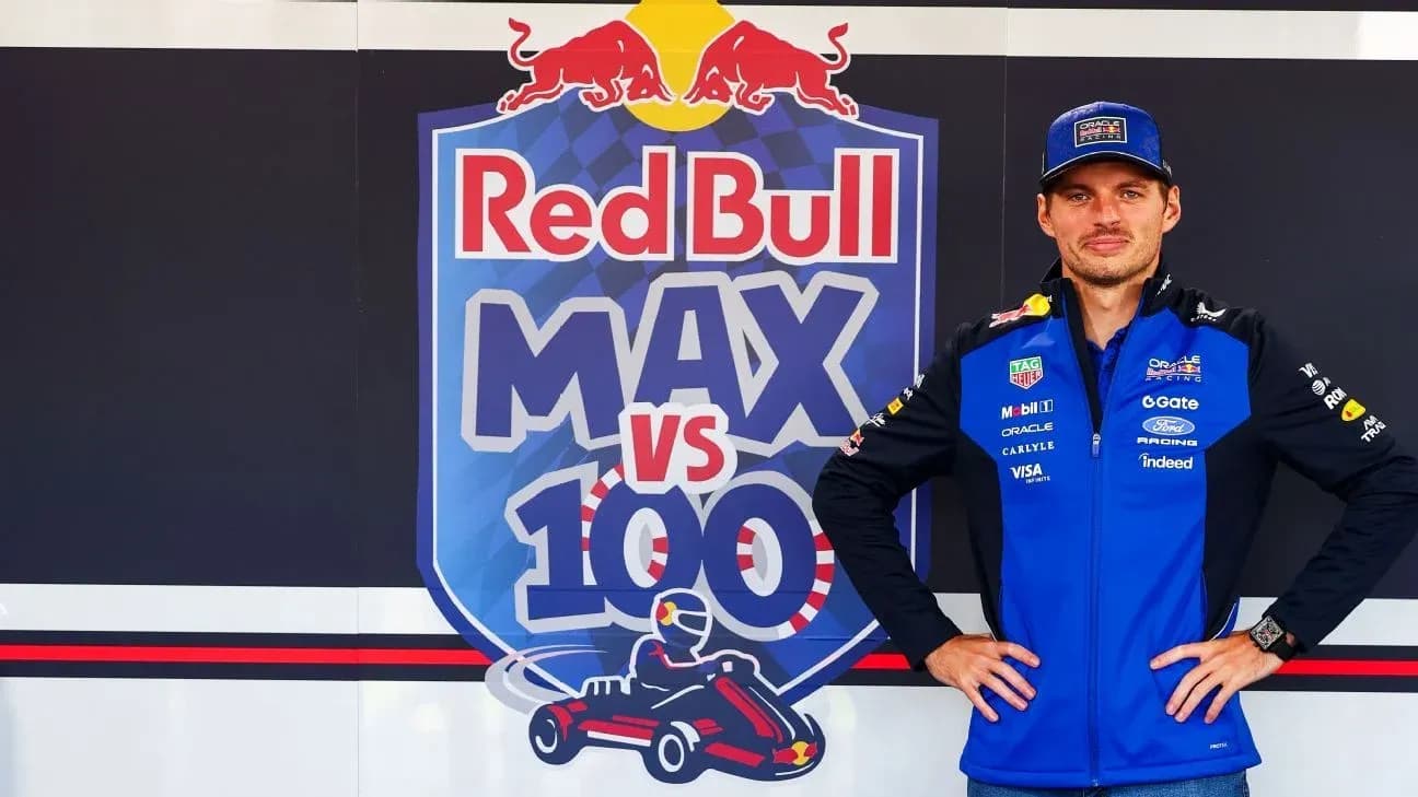 Piloto posando frente a cartel de Red Bull Piloto posando frente a cartel de Red Bull