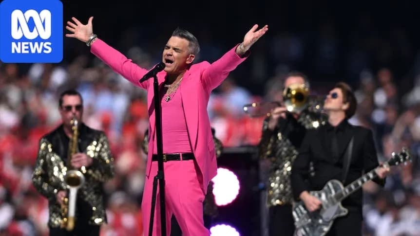 Robbie Williams actuando en un evento musical Robbie Williams actuando en un evento musical