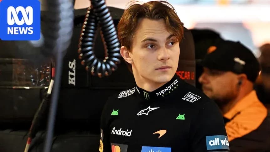 Piloto de Fórmula 1 en el garaje de McLaren Piloto de Fórmula 1 en el garaje de McLaren