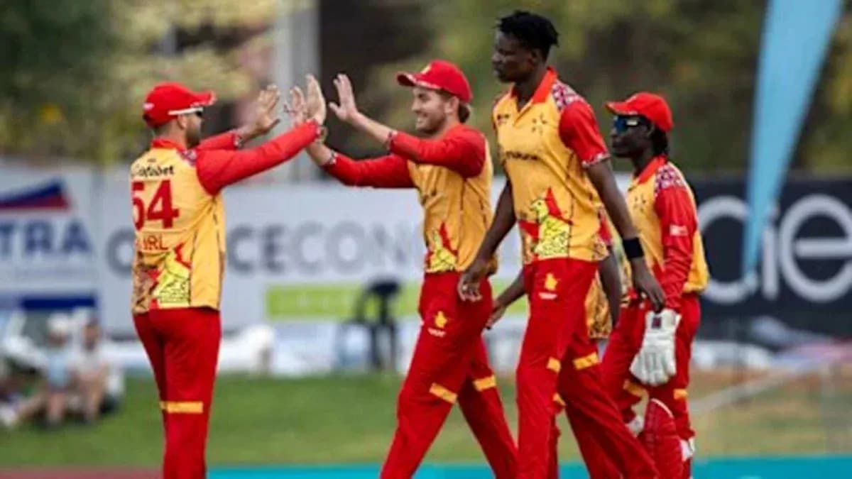 Jugadores de cricket celebrando una captura exitosa Jugadores de cricket celebrando una captura exitosa